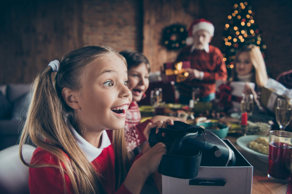 Kids opening virtual reality system, to illustrate gadget gift ideas