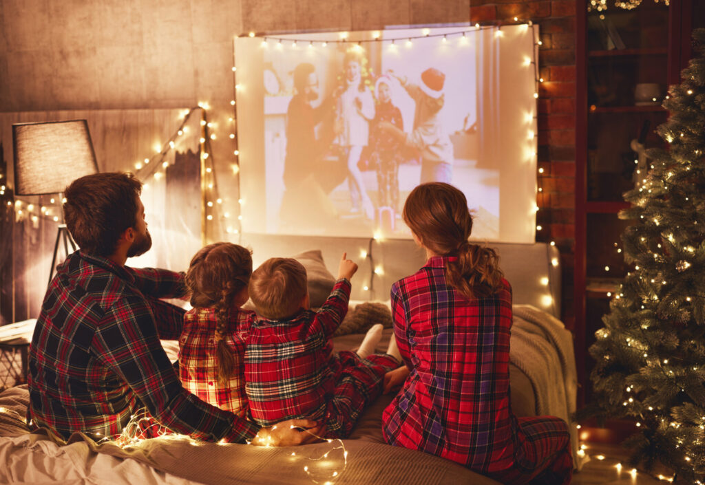 Family watching favourite family-friendly holiday movies