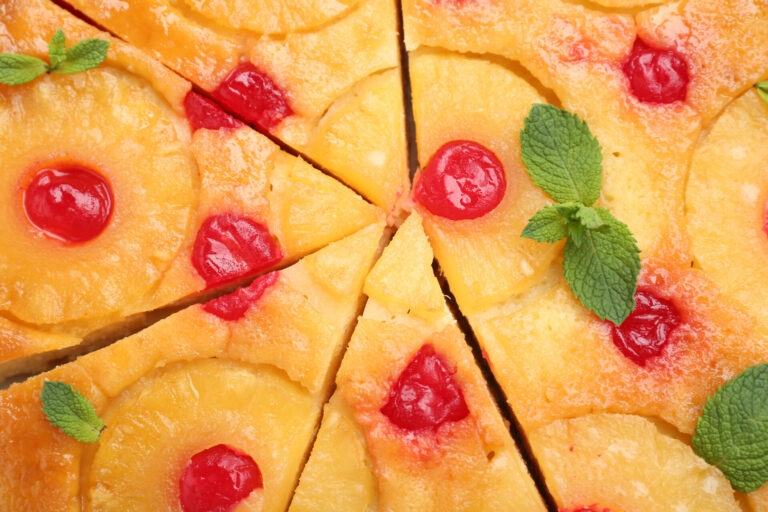 Pineapple squares garnished with maraschino cherries