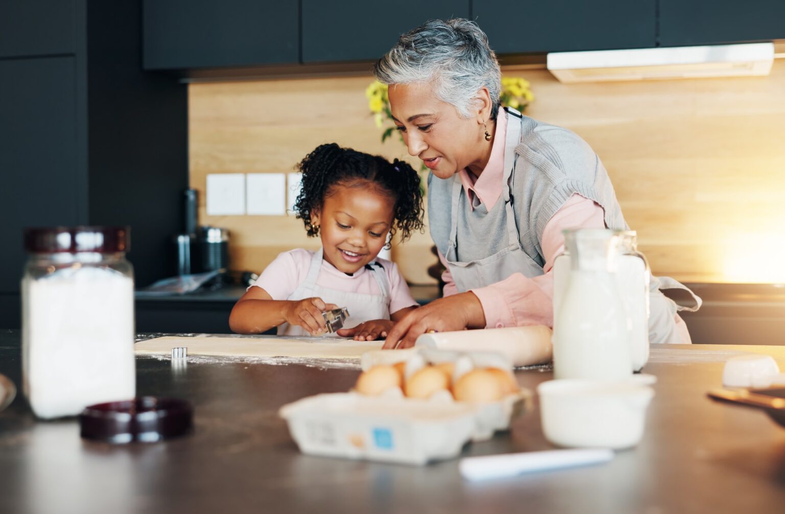 grandmother and grandchild in the kitchen baking cookies