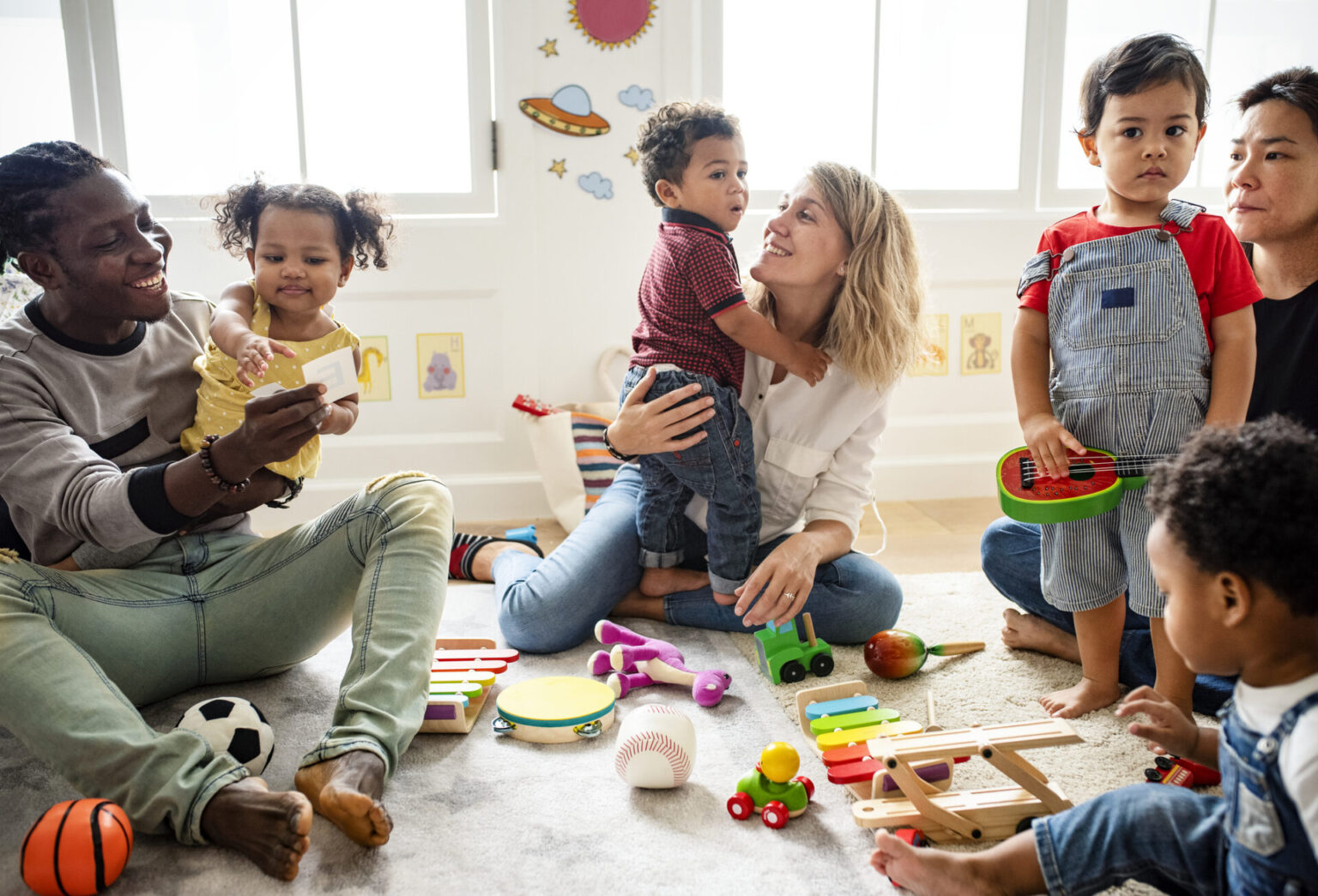 Families playing together to illustrate social parenting