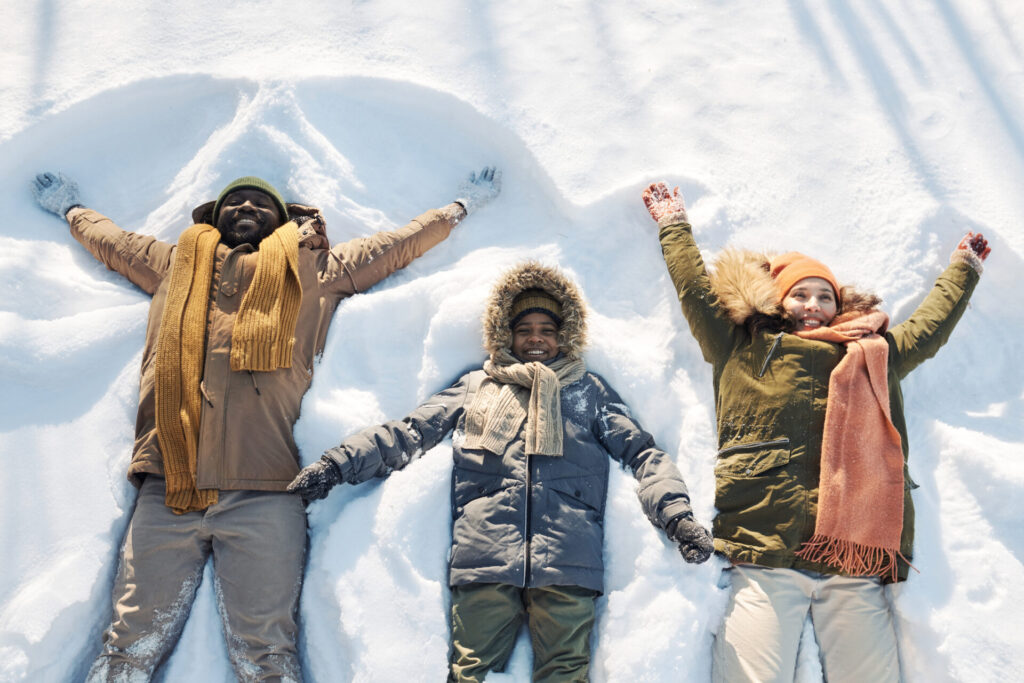 Family making snow angels for Global Day of Unplugging