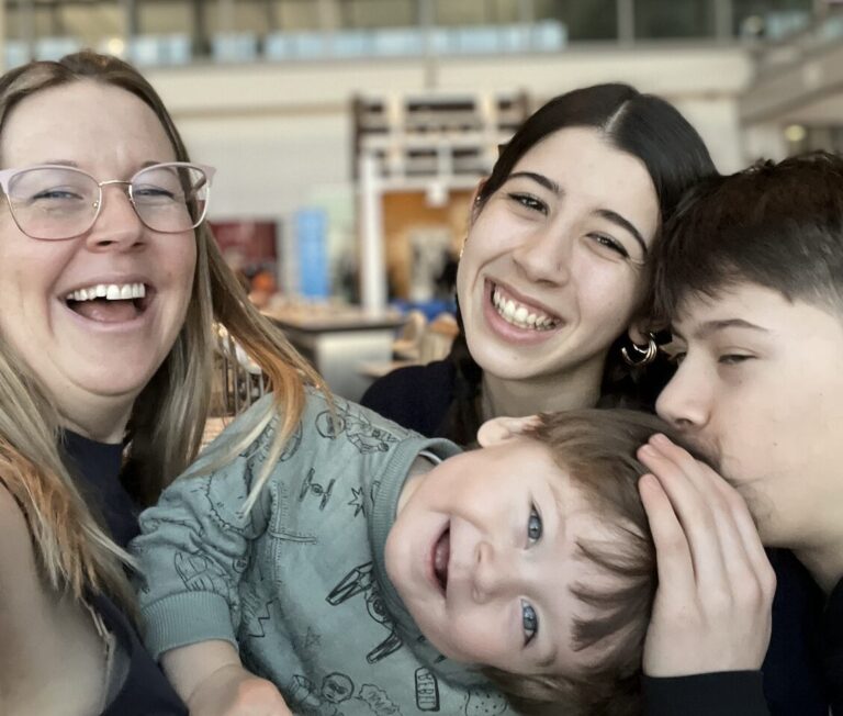 The writer, Jenn Dunstan, with her teens and her toddler