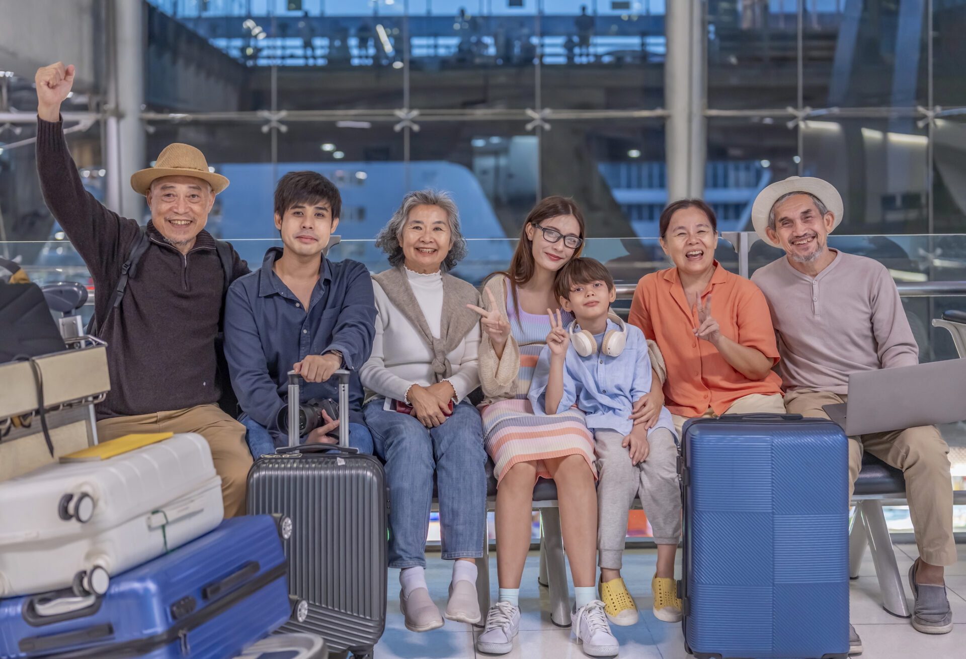 Family in the airport, to illustrate multigenerational travel