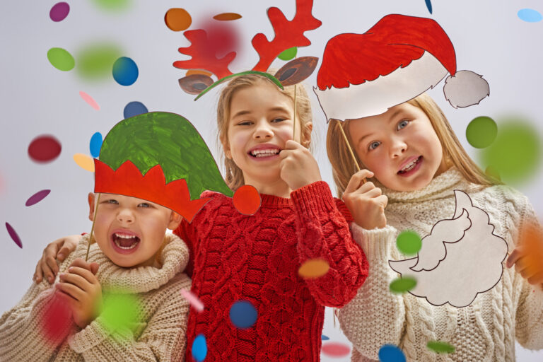 Kids with crafts to show how to entertain with kids during the holiday season