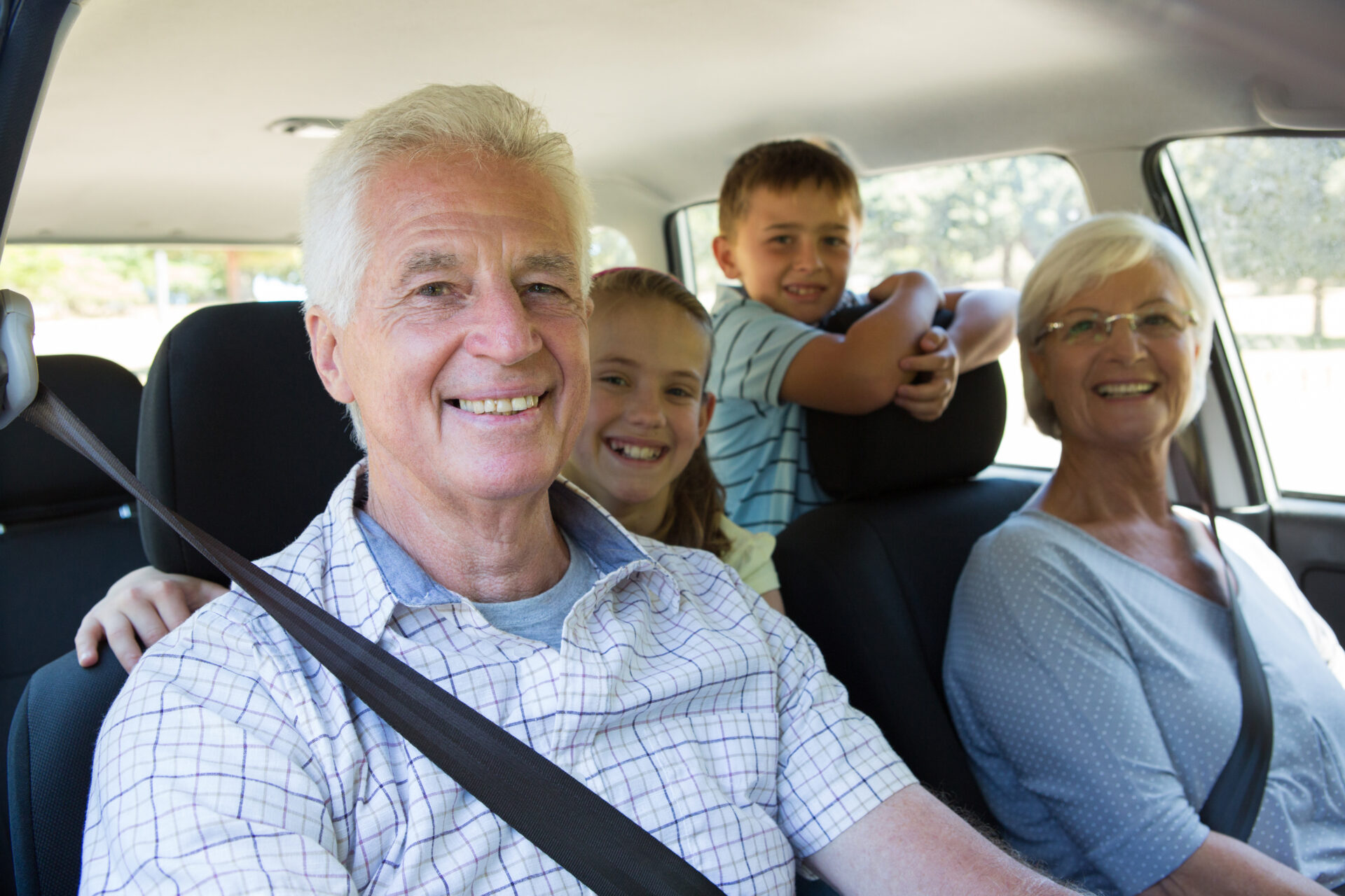 Grandparents in the car with grandchildren