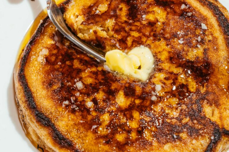 A perfectly griddle-marked pancake with a heart-shaped pad of butter.