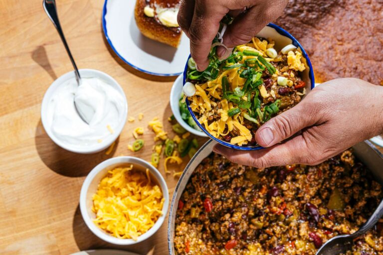 Bowl of turkey chili with lots of toppings