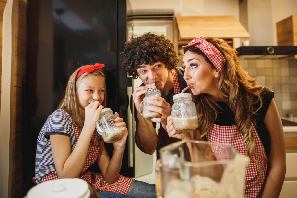 Family drinking milkshakes to illustrate nostalgic activities to do together