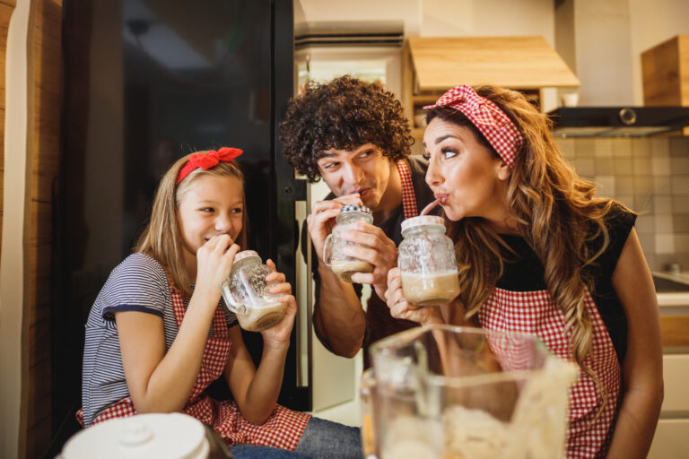 Family drinking milkshakes to illustrate nostalgic activities to do together