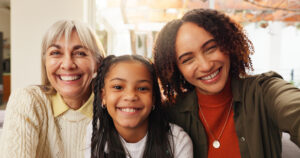 Three generations of women together to illustrate the motherline