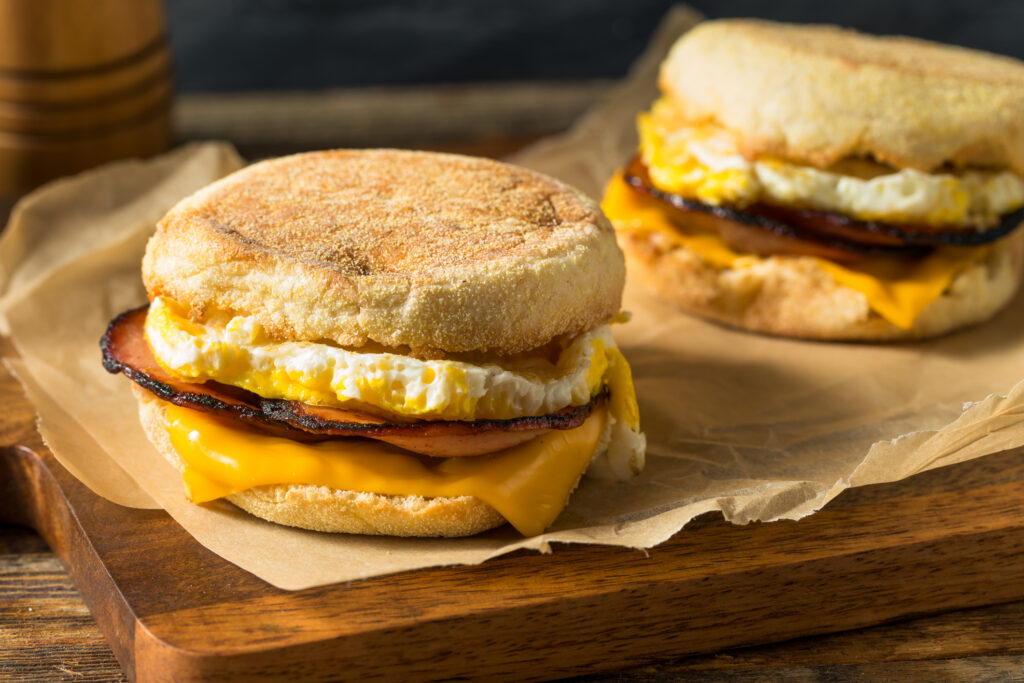 Homemade freezer breakfast sandwiches on parchment
